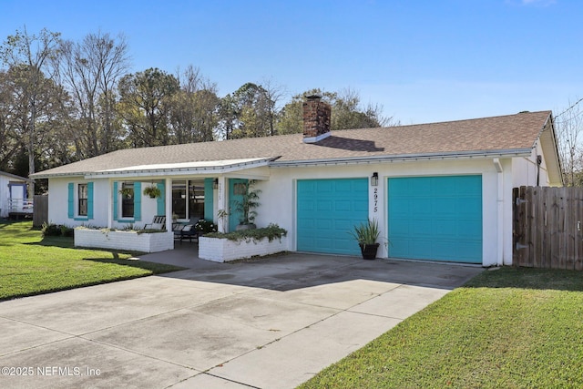 single story home with a garage and a front yard