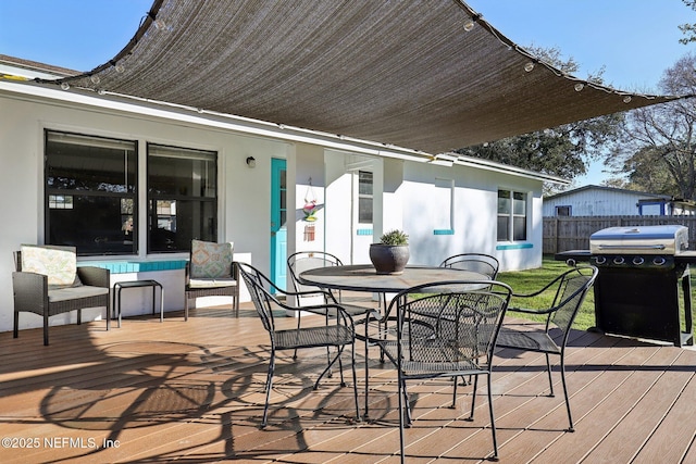 wooden terrace featuring grilling area