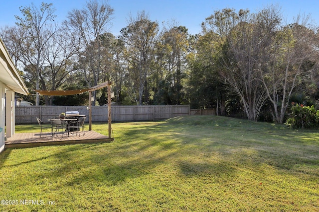 view of yard featuring a wooden deck