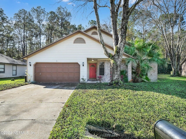 view of front facade with a garage and a front lawn