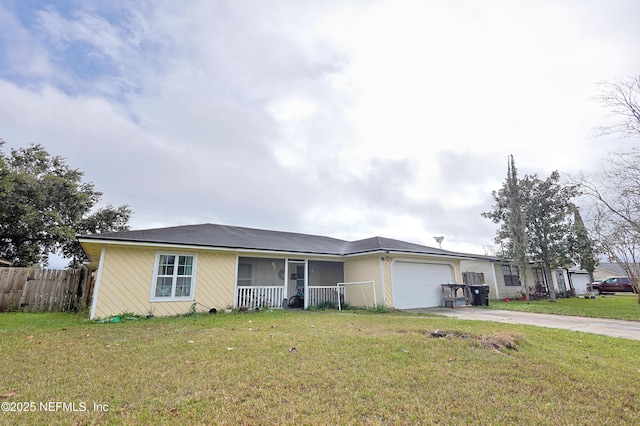 single story home featuring a front yard and a garage