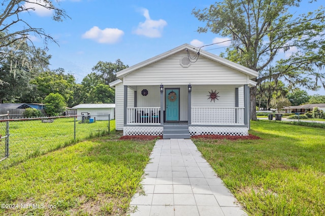 view of front of home featuring a front lawn and a porch