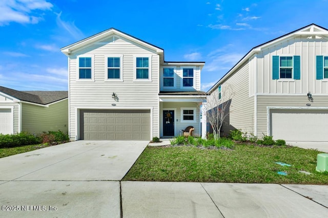 view of front of home featuring a garage and a front lawn