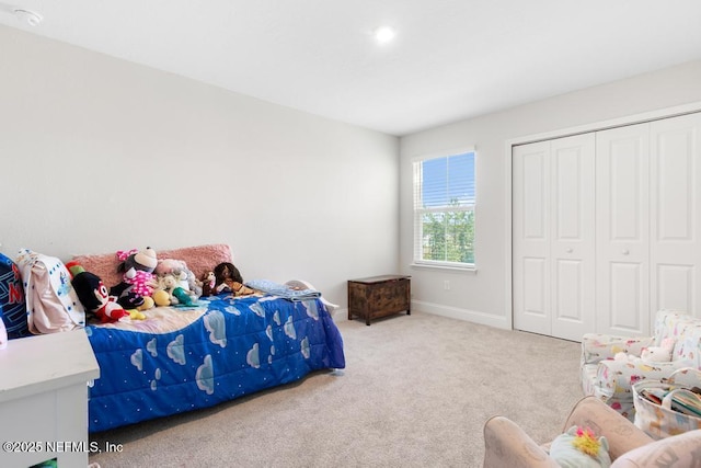 carpeted bedroom featuring a closet