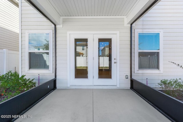 property entrance featuring french doors and a patio