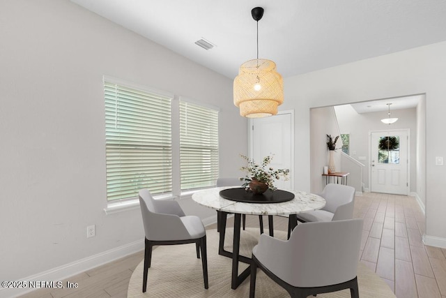 dining space featuring light hardwood / wood-style floors