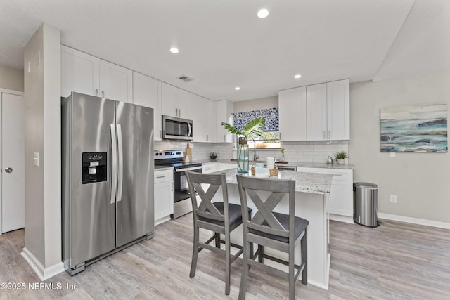 kitchen featuring white cabinetry and stainless steel appliances