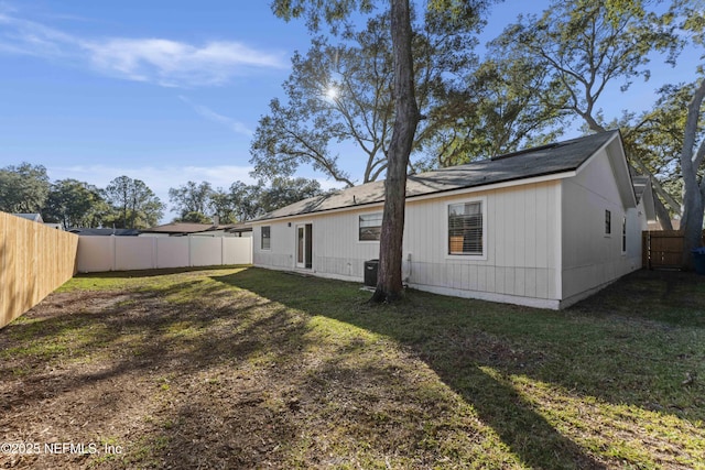 rear view of house with a lawn