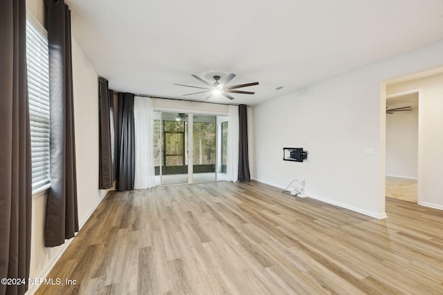 unfurnished room featuring light hardwood / wood-style floors and ceiling fan