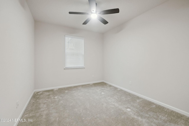 empty room with carpet flooring and ceiling fan