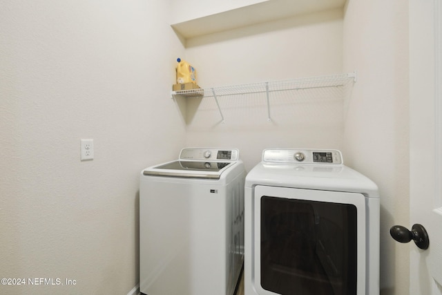 laundry room with independent washer and dryer