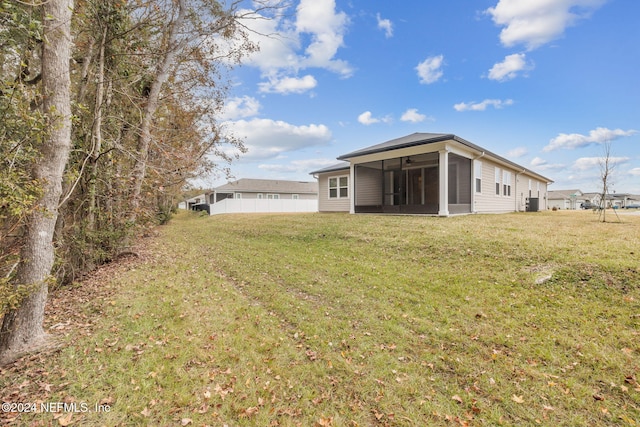 view of yard with a sunroom