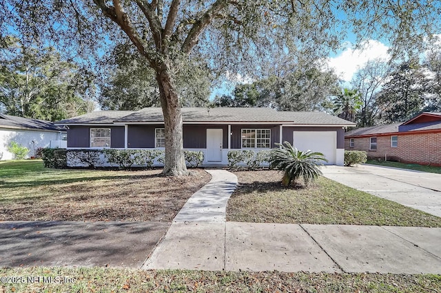 single story home with a garage and a front yard