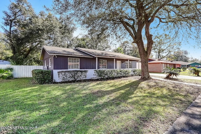 ranch-style home with a front yard