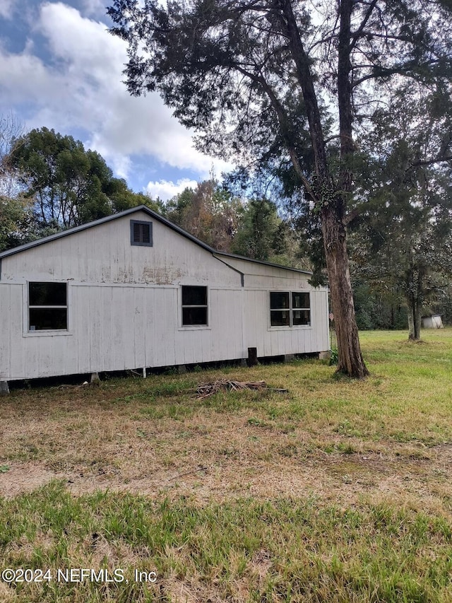 view of home's exterior featuring a lawn