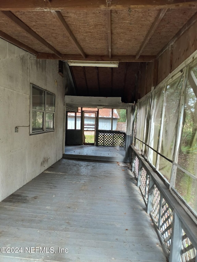 interior space featuring wood-type flooring and lofted ceiling