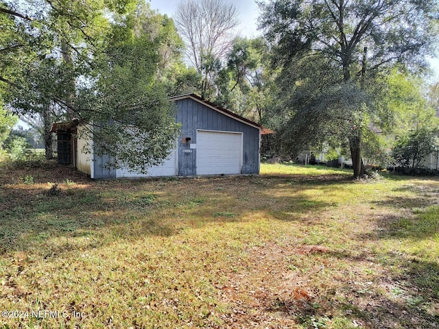 view of yard with an outbuilding and a garage