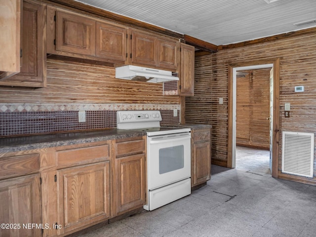 kitchen featuring white range with electric stovetop and wooden walls