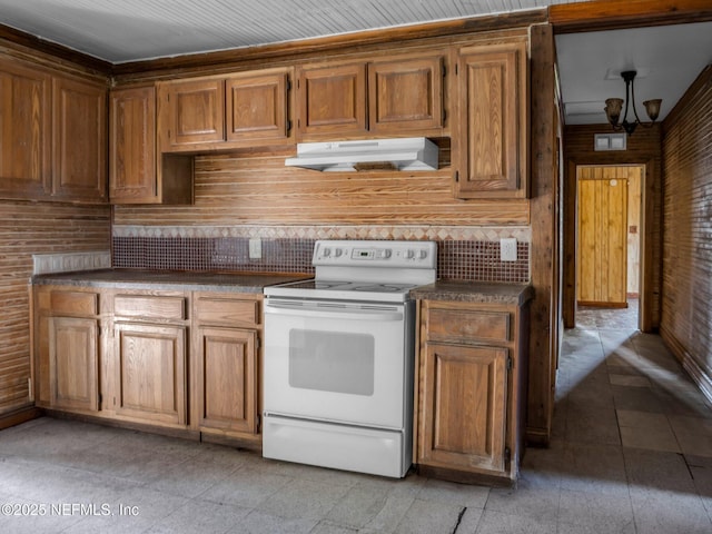 kitchen with backsplash, an inviting chandelier, and white electric stove