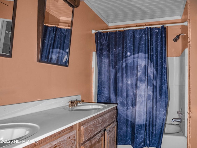 bathroom with crown molding, vanity, and shower / bath combination with curtain