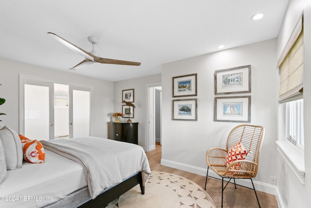 bedroom with ceiling fan and light hardwood / wood-style flooring