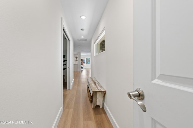 hall with light wood-type flooring