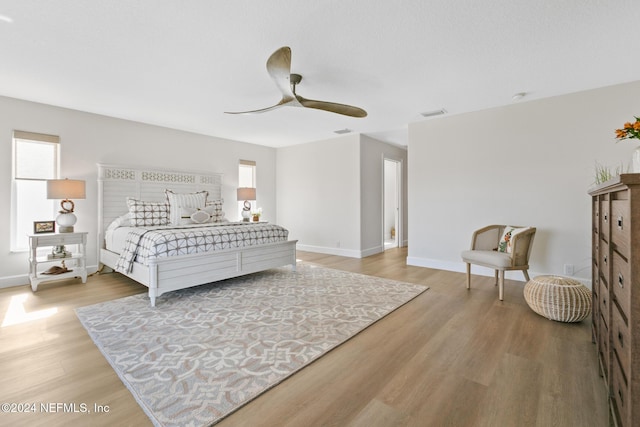 bedroom featuring hardwood / wood-style floors and ceiling fan