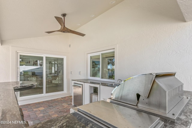 view of patio with area for grilling, ceiling fan, and sink