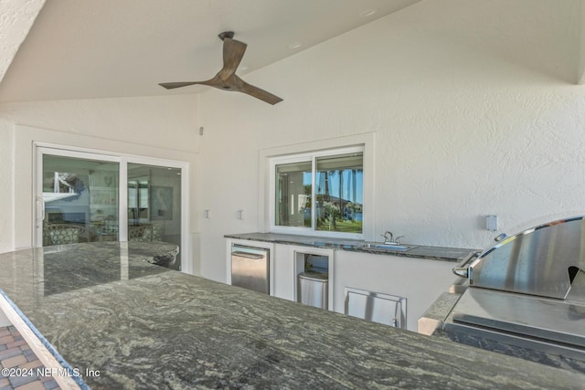 view of patio with ceiling fan and exterior kitchen