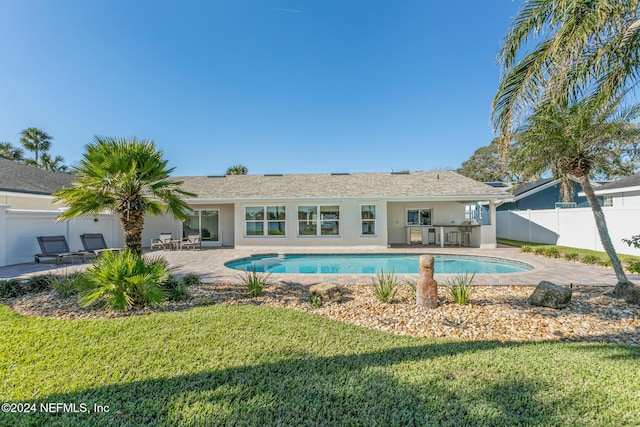 view of pool featuring a yard and a patio area