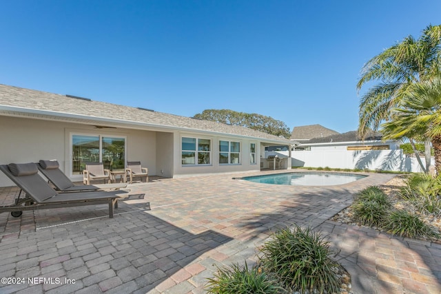 view of swimming pool with a patio area