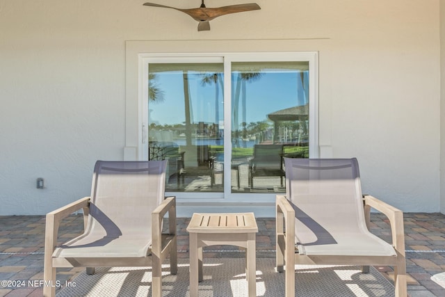 view of patio featuring ceiling fan