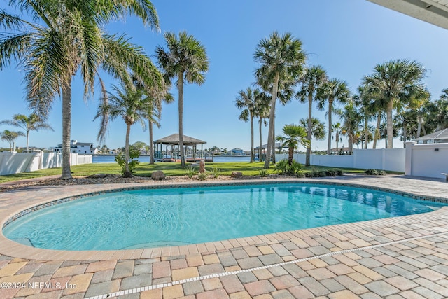 view of swimming pool featuring a water view