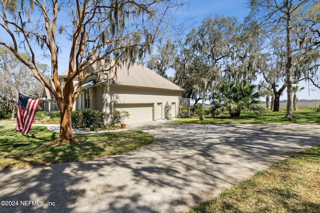 view of side of property featuring a garage