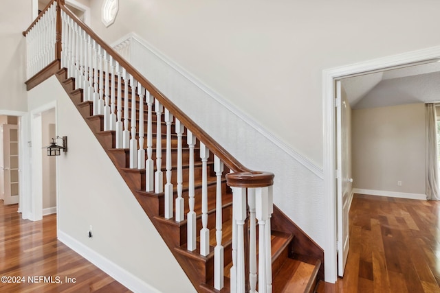 stairs featuring wood-type flooring