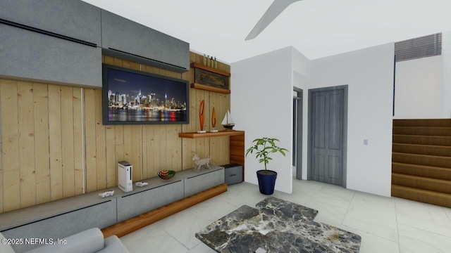 living room with wood walls