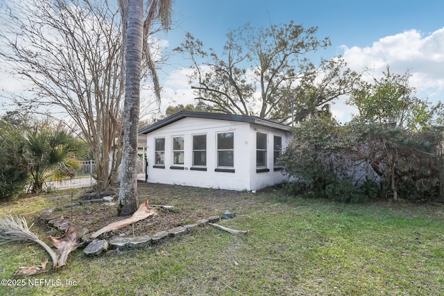 view of home's exterior featuring a lawn