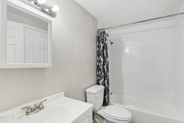 full bathroom with vanity, shower / bath combination with curtain, a textured ceiling, and toilet