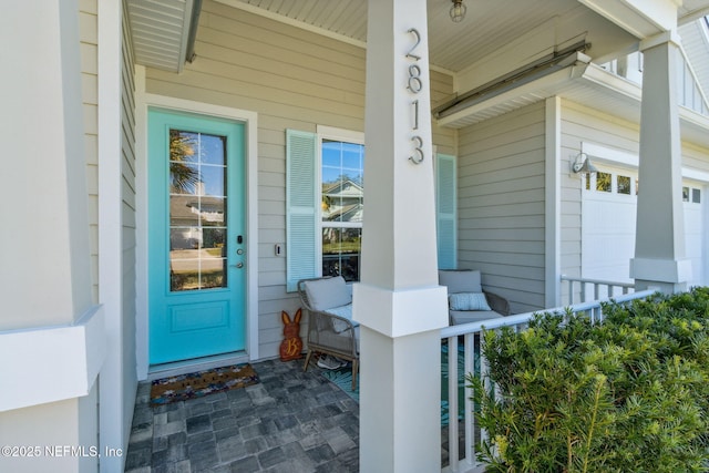 doorway to property featuring a garage