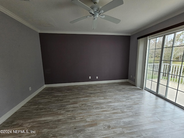 unfurnished room featuring crown molding, ceiling fan, wood-type flooring, and a textured ceiling