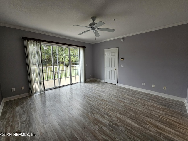 empty room featuring ceiling fan, ornamental molding, dark hardwood / wood-style flooring, and a textured ceiling