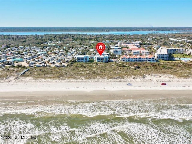 bird's eye view featuring a view of the beach and a water view