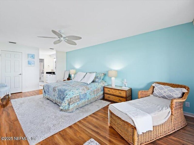 bedroom featuring ceiling fan and dark hardwood / wood-style flooring