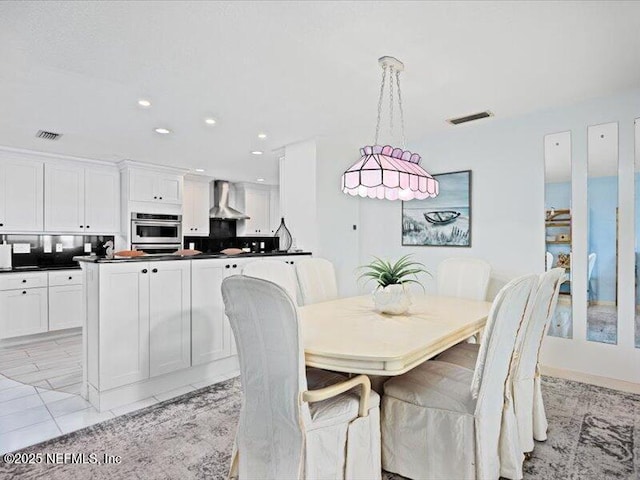 dining area featuring light tile patterned flooring