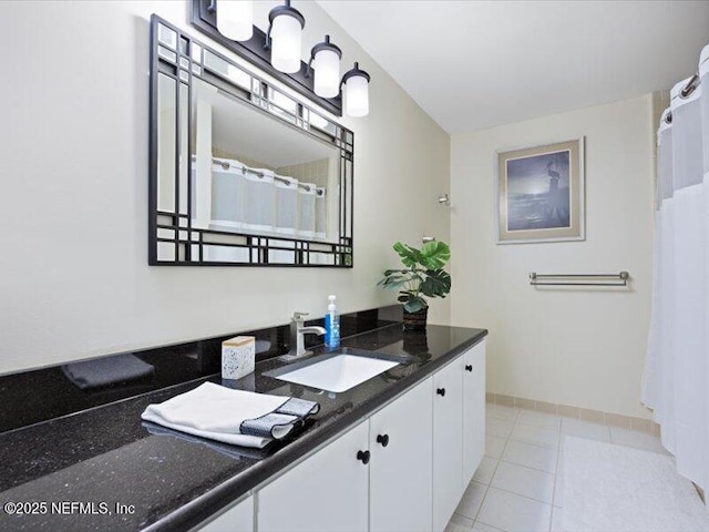 bathroom featuring tile patterned flooring and vanity