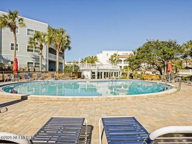 view of swimming pool with a patio