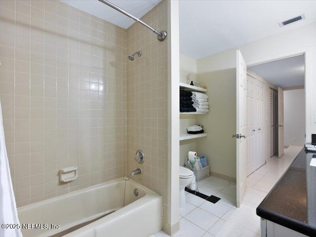 full bathroom with tile patterned flooring, vanity, toilet, and shower / bath combo with shower curtain