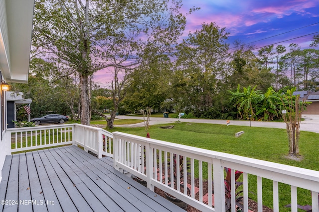 deck at dusk with a yard