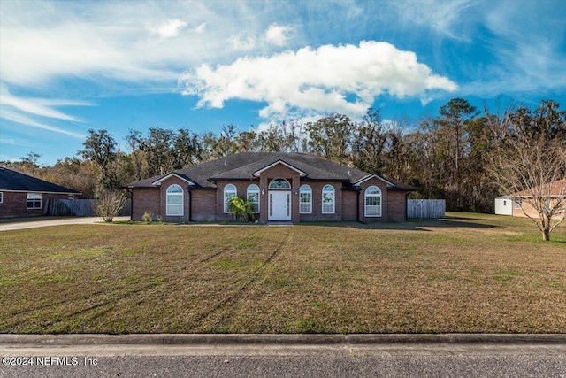 ranch-style home with a front yard