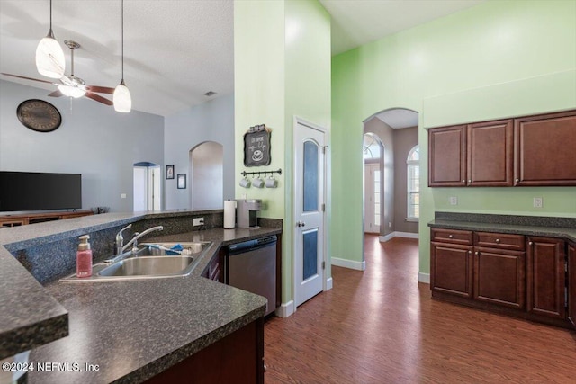 kitchen with sink, stainless steel dishwasher, ceiling fan, decorative light fixtures, and dark brown cabinetry